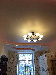 Двухуровневый сатиновый натяжной потолок с подсветкой красного цвета